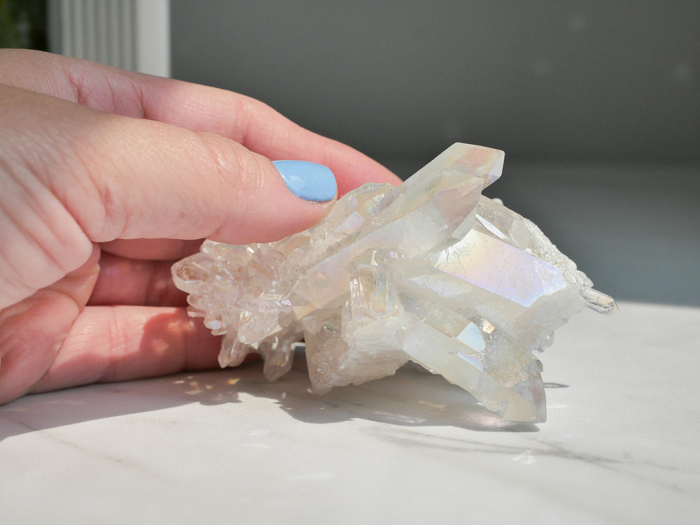 Aura coated quartz cluster with vibrant iridescent rainbow colors