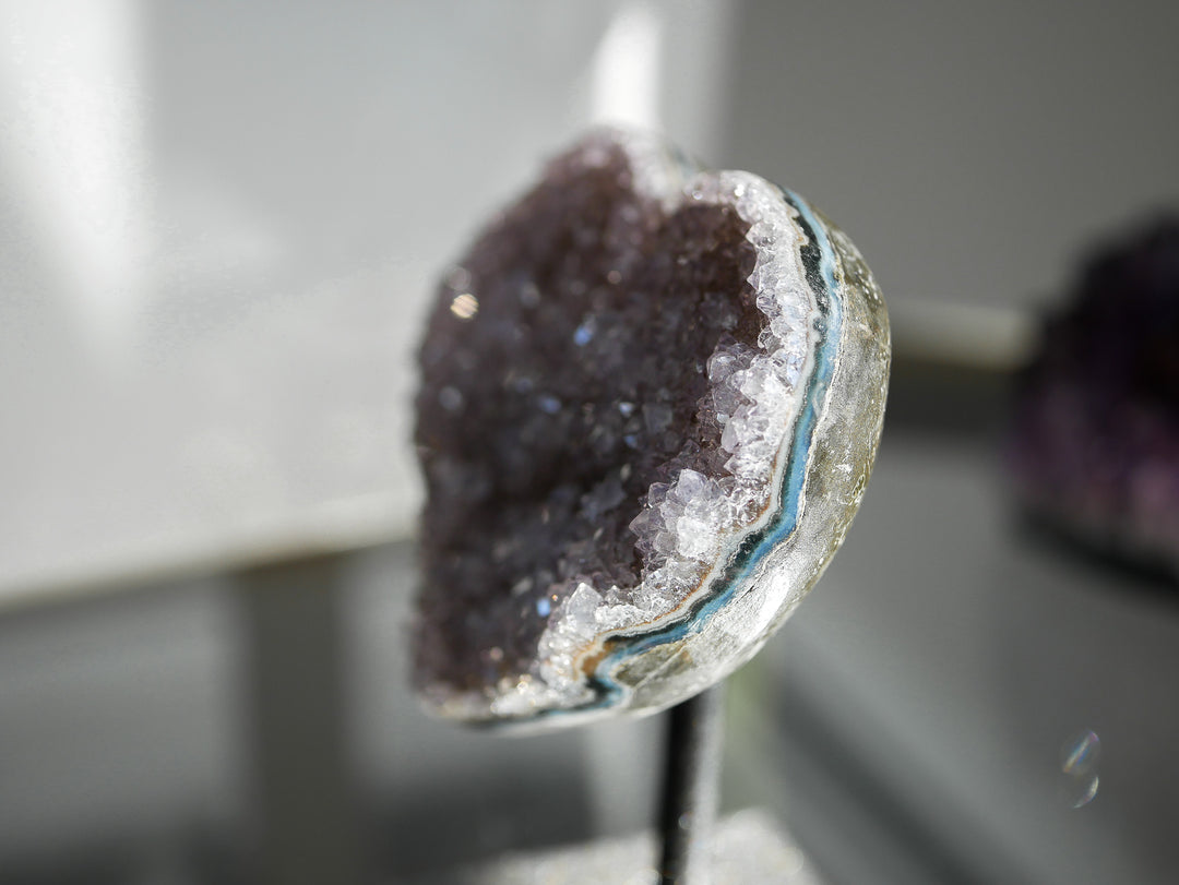 Close up picture of the rainbow amethyst heart on stand side view