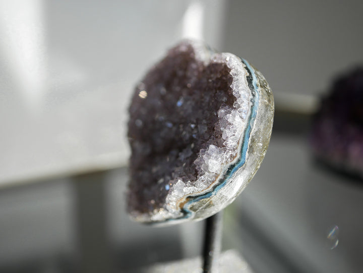 Close up picture of the rainbow amethyst heart on stand side view